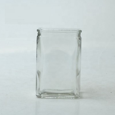 colored square glass vase for flower arrangement